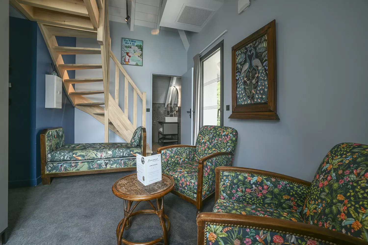 room 31 lounge area with wooden staircase